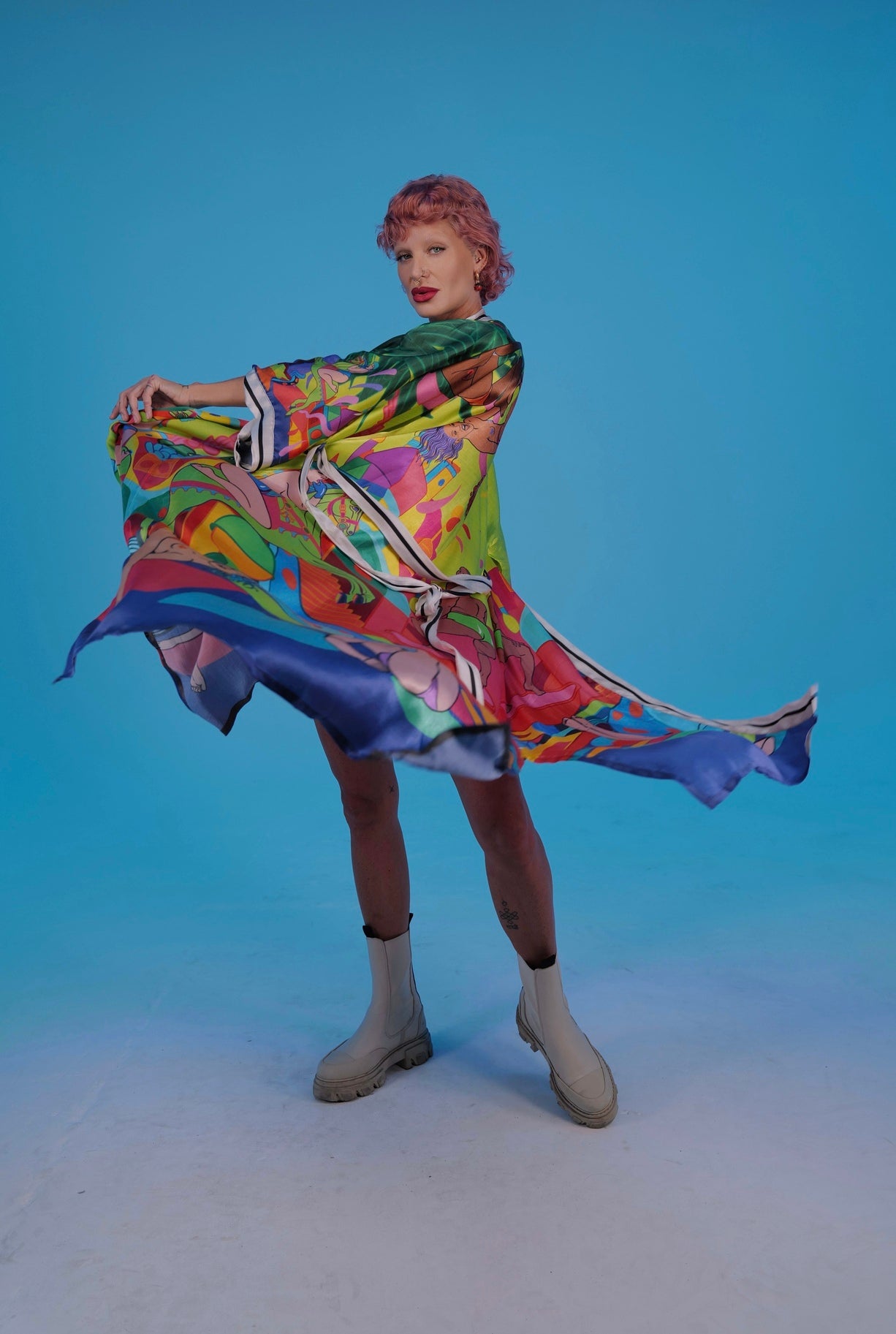 Side view showing silhouette and functional pockets of Girls Neon Kimono