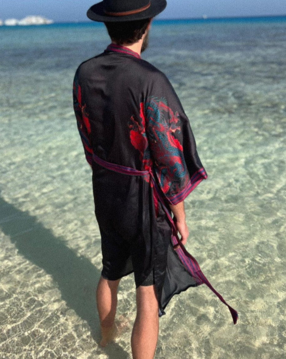 Back view of flowing kimono showcasing artwork and soft black fabric