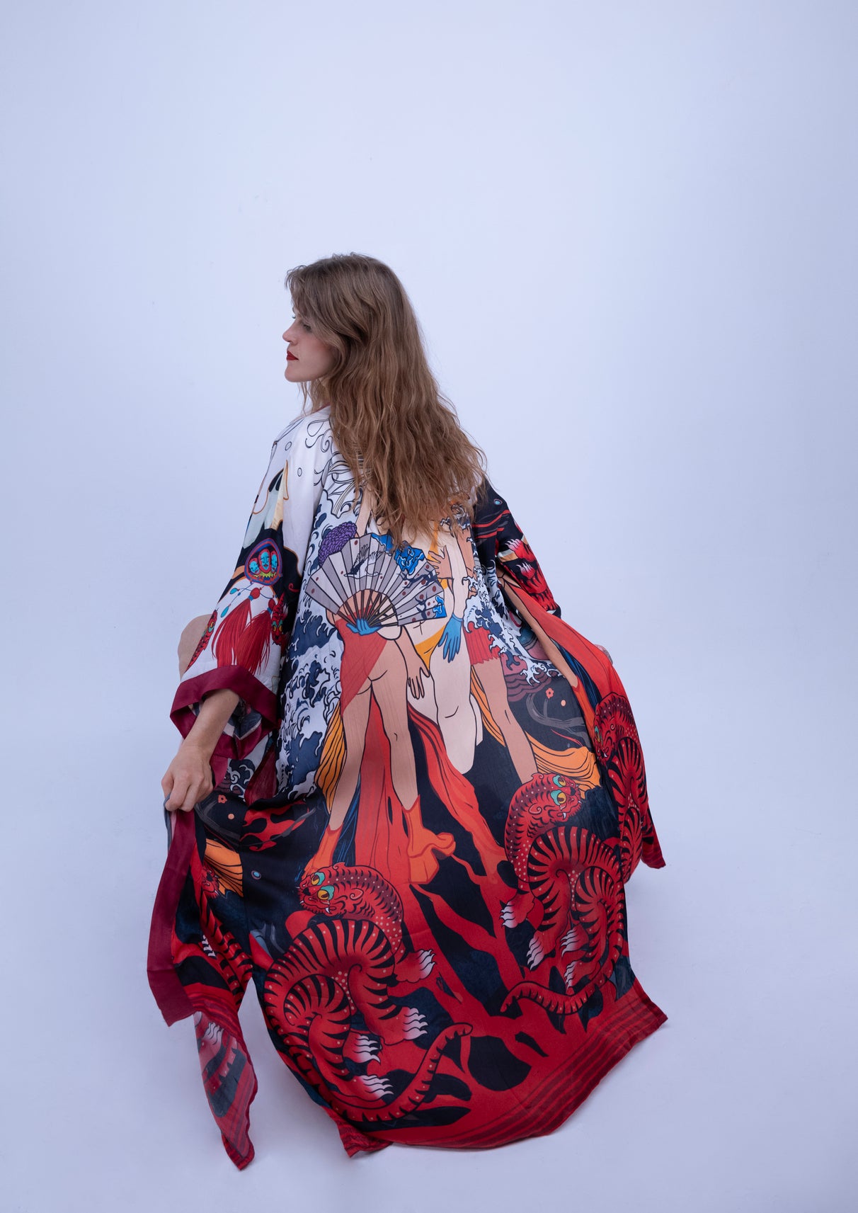 girl waering  flowing artistic kimono showing design and drape back view