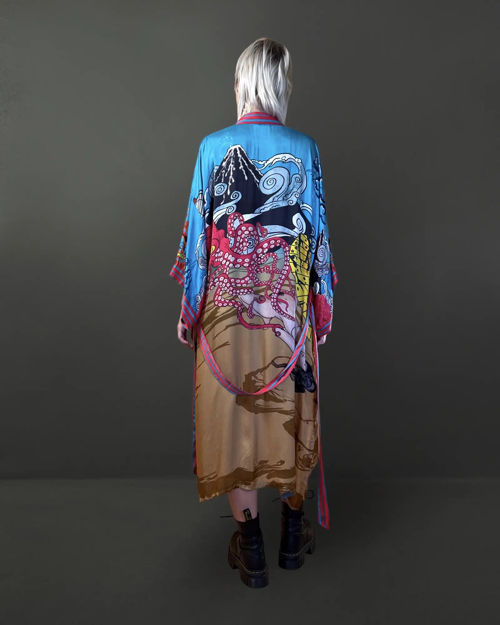 Back view showing flow and hand-drawn detail on gold fabric